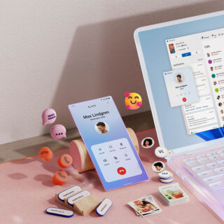msft open laptop with mobile phone floating emojis RW10WBx